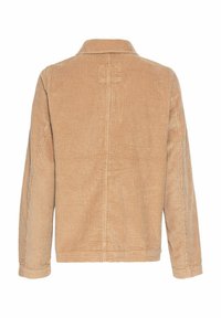 Beige Cordjacke mit Kragen, langen Ärmeln und strukturierter Oberfläche. Verfügt über eine genähte Naht entlang der Mitte des Rückens.
