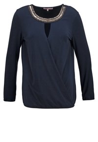 Marinefarbener Langarmoberteil mit Wickeldesign und Schlüssellochdetails. Verfügt über einen mit Perlen besetzten Ausschnitt und einen weichen, leichten Stoff.