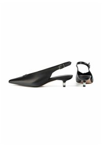 Black leather slingback shoes with a pointed toe, low heel, and adjustable buckle strap. Smooth texture and minimalist design accents.