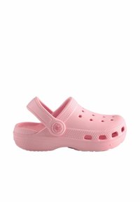 Roosa kummist sandaal ventilatsiooniaukudega, pöörleva kontsarihmaga, sileda tekstuuri ja ümarate vormidega, rihmal asuv kõrgendatud lillemotiiv.