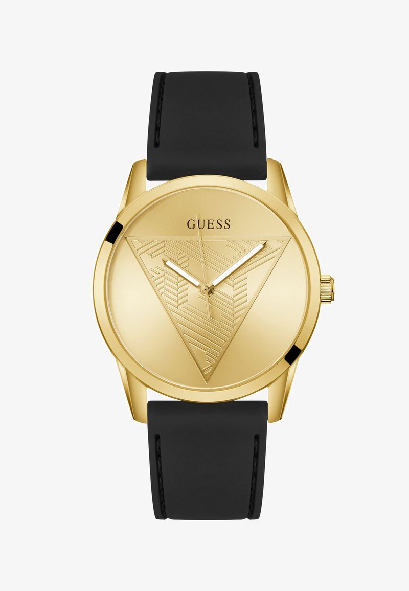 Relógio de pulso Guess em tom dourado com bracelete preto, mostrador minimalista apresentando um design de triângulo texturizado e três ponteiros prateados.