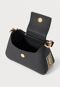 Black leather handbag with gold hardware, trapezoidal shape, magnetic snap closure, and an interior pocket. Features a prominent logo accent.