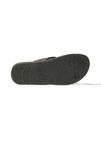 Sole di infradito nera con motivo di presa testurizzato. Presenta un design piatto e bordi lisci, adatto per un abbigliamento casual.