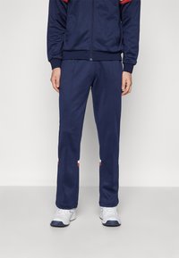 Sergio Tacchini ORION PANTS - Tepláky - navy/red ochre