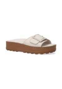 Plattform-Slidesandale aus hellbeigem Leder mit einem breiten Riemen und Schnallen-Detail, auf einer braunen strukturierten Gummisohle.
