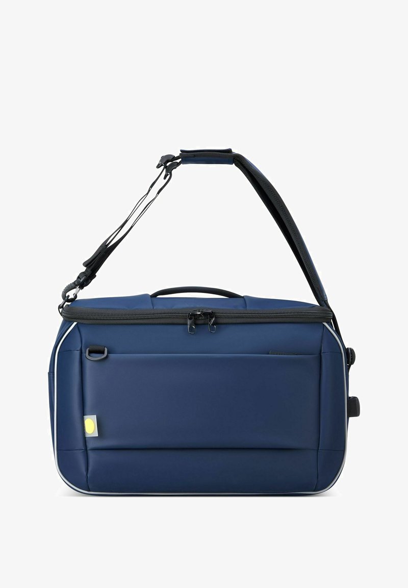 Borsa a spalla blu navy con lati imbottiti, zip nera, tracolla regolabile, tasca frontale e dettaglio del logo giallo sul lato.
