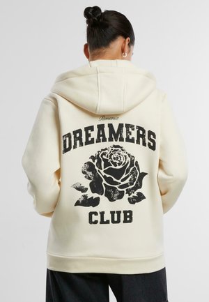 Cremefarbener Hoodie mit einem schwarzen Rosenmotiv und dem Text "DREAMERS CLUB" auf dem Rücken, ausgestattet mit einer Kapuze und gerippten Bündchen.