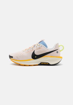 Light pink running shoe with black and yellow accents, mesh upper, cushioned sole, rounded toe, and laces with reinforced eyelets.