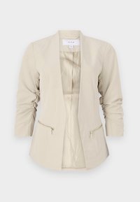 Beżowa marynarka o luźnym kroju, z otwartym przodem, rękawami o długości trzech czwartych oraz podwójnymi kieszeniami na zamek. Gładki materiał o delikatnym połysku.