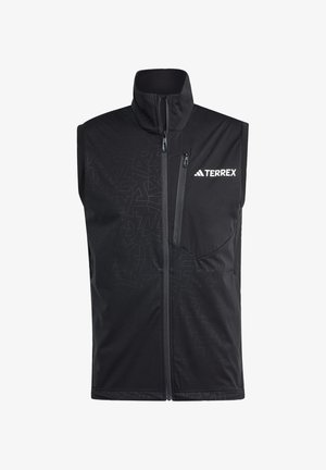 Black sleeveless vest with a high collar, featuring a tonal abstract pattern on the left side and a zippered pocket. "TERREX" logo on chest.