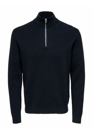 Navy knit sweater with a high collar and silver zipper. Features ribbed texture and long sleeves, offering a fitted, streamlined shape.
