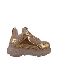 Chunky sneakers featuring a beige fabric upper with gold metallic accents, textured paneling, and a thick, cushioned sole.