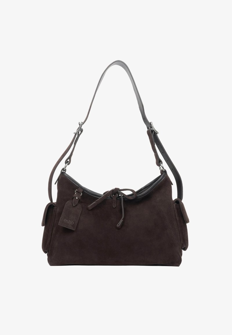 Dark brown suede shoulder bag with adjustable strap, front tie detail, side pockets with flaps, and attached brand tag.