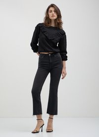 Calliope TRAFORATA CON ROUCHES - Maglione - nero