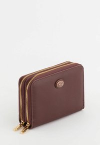 Brown textured leather wallet with gold zippers, featuring two compartments and a round logo accent on the front.