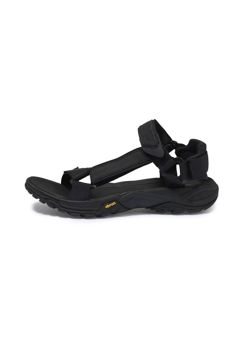 Černé turistické sandály s nastavitelnými popruhy, s texturovanou podrážkou a logem Vibram. Mají pevný design pro pohodlí a trvanlivost.