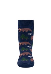 Skarpety z wełny w kolorze granatowym, z wzorem przedstawiającym niedźwiedzia i drzewo w kolorze brązowym i zielonym. Miękka tekstura z ściągaczem na górze.