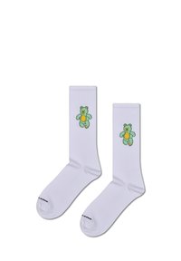 Białe skarpetki bawełniane z grafiką zielonego misia na każdej skarpetce, z żółtym brzuchem i czarnym konturem. Żebrowane mankiety i wzmocnione palce.