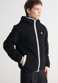 Tommy Jeans - BADGE ZIP TRU UNISEX - Fliisjakk - black Väikepilt 1