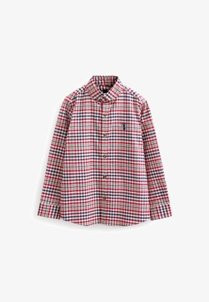 Chemise à manches longues boutonnée avec motif à carreaux rouge, marine et blanc et logo cerf marine brodé sur la poche poitrine.