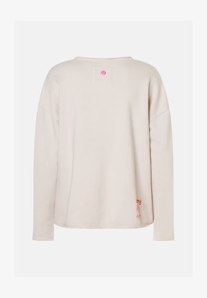 Beige Sweatshirt mit langen Ärmeln und lockerer Passform, kleinem rosa Rundlogo am Hals und buntem gesticktem Text sowie Herz am unteren Saum.