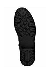 Suela de zapato de goma negra con un diseño texturizado y patrones variados para tracción; incluye un logo y un indicador de tamaño.