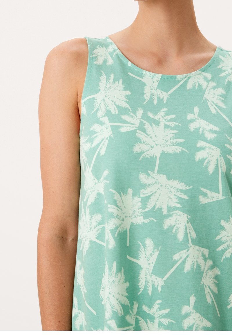 Helles grünes Tanktop mit einem weißen Palmenmuster. Hergestellt aus weichem Stoff, mit Rundhalsausschnitt und ärmellosem Design.