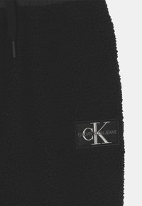 Calvin Klein Jeans MIX MEDIA - Tréningruha alsók - black