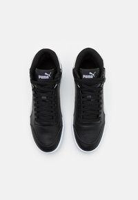 Black high-top sneakers made of leather with synthetic accents, featuring flat laces, perforated toe, and contrasting white rubber sole.