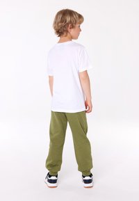 Champion GRAPHIC CREWNECK UNISEX - Camiseta estampada - white