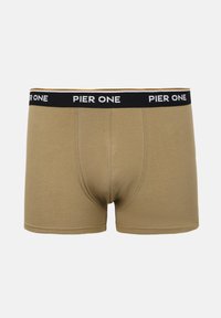 Beige herre-boxershorts med sort elastisk taljebånd med hvid "PIER ONE"-branding, frontpanel med syninger, fladt lagt på hvid baggrund.