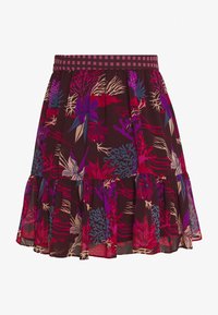 Bloemrijke rok van donkerbruin stof met levendige paarse, roze en blauwe botanische patronen. Beschikt over een gerimpelde zoom en een geruite elastische tailleband.