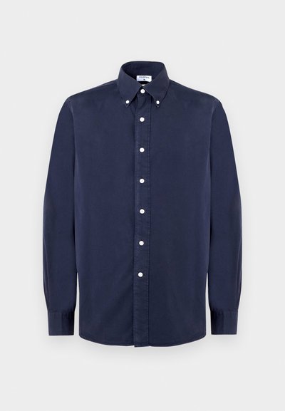 Chemise à manches longues bleu marine, boutonnée, en coton, avec un col classique, des boutons blancs et une texture lisse.