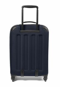 Maleta rígida de color navy con estrías verticales, asas retráctiles y cuatro ruedas giratorias. Detalles en negro en las esquinas y en la base.