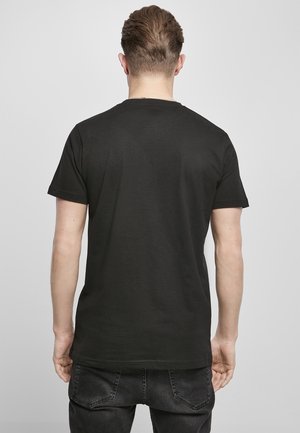 Schwarzes T-Shirt mit kurzen Ärmeln und Rundhalsausschnitt, aus Baumwolle, mit glatter Textur und einfachem Design. Von hinten angezeigt.