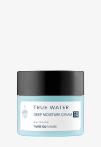 Ljusblå glasburk med svart lock, märkt "True Water Deep Moisture Cream EX," innehåller 80 ml kräm. Ren, minimalistisk design.