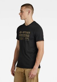G-Star RAW Distressed Logo T-Shirt Uomo – Maglietta Basic Con Logo Invecchiato, Manica Corta - 2