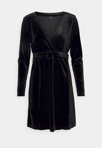 Svart sammetklänning med långa ärmar, V-urtordination och midjebälte. Har en mjuk textur och knälång design.