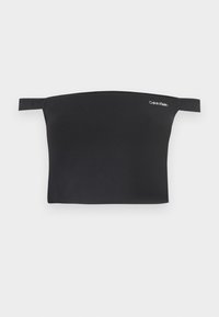 Top corto nero con design off-shoulder, realizzato in tessuto morbido. Presenta spalline sottili e un piccolo logo bianco di Calvin Klein sul davanti.