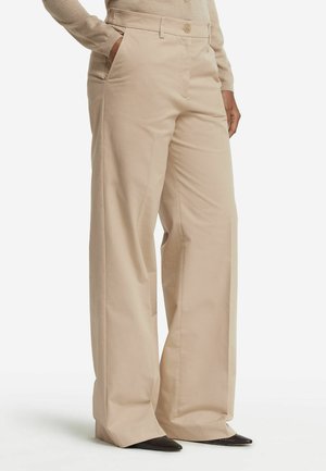 Pantaloni palazzo beige realizzati in misto cotone con frontale piatto, due tasche laterali e chiusura con bottone. Tessuto morbido con vestibilità su misura.