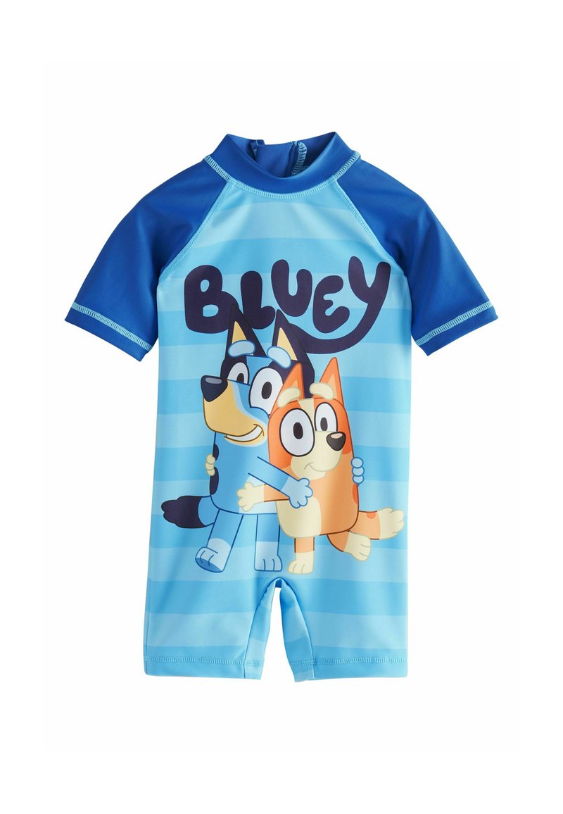Maillot de bain pour enfants à manches courtes, bleu clair, avec un motif de chien cartoon bleu et orange. Il présente un col rond et une fermeture éclair à l'arrière.
