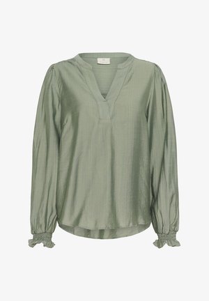 Groene blouse met lange mouwen van zachte stof. Heeft een diepe v-hals, gathering op de mouwen en een losse pasvorm met een ronde zoom.