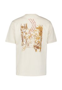 Crème kleurige katoenen t-shirt met een goudkleurige afbeelding van een pad met planten en tekst in een gebogen indeling op de achterkant.