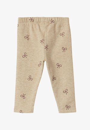 Beige Leggings aus weichem Stoff mit einem wiederholten Muster kleiner lila Schleifen. Elastischer Bund oben.