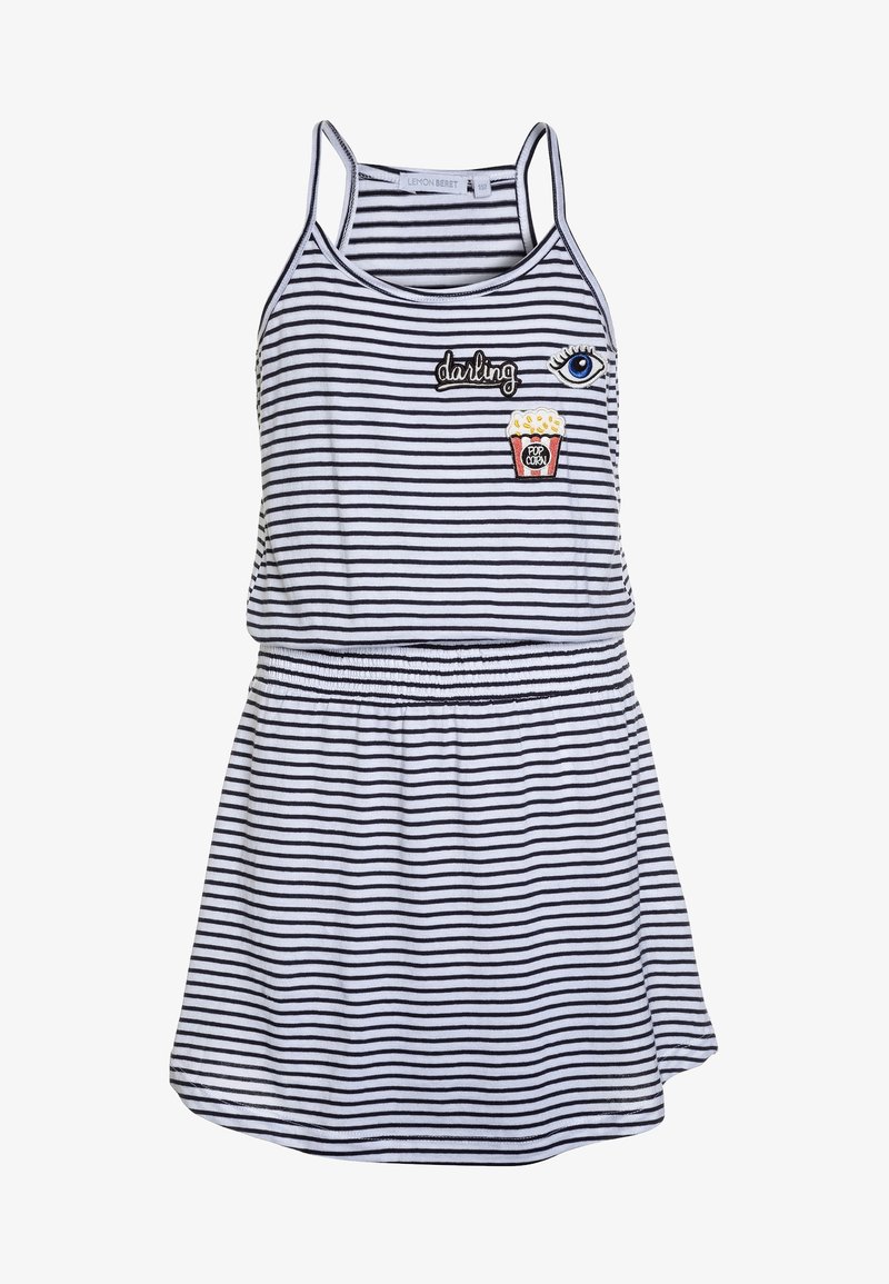 Robe sans manches à rayures blanches et noires avec taille élastique, ornée de patchs représentant un œil, le mot "darling" et une boîte de popcorn.