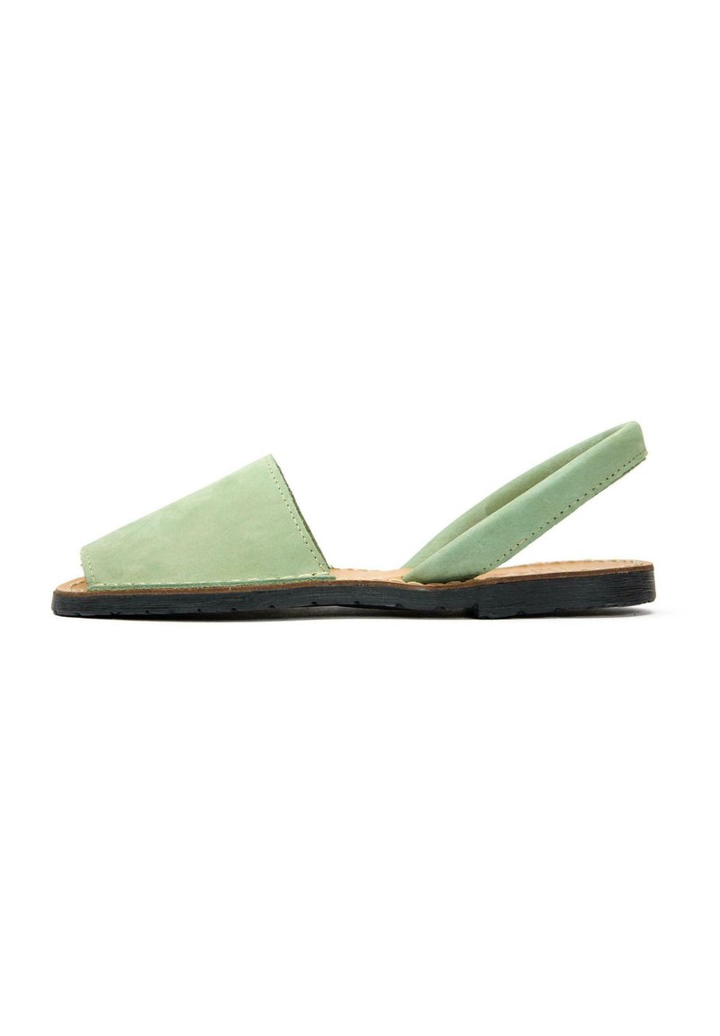 Green suede slingback sandal with a triangular toe box, soft fabric texture, and a flat black rubber sole. Simple design with minimal hardware.