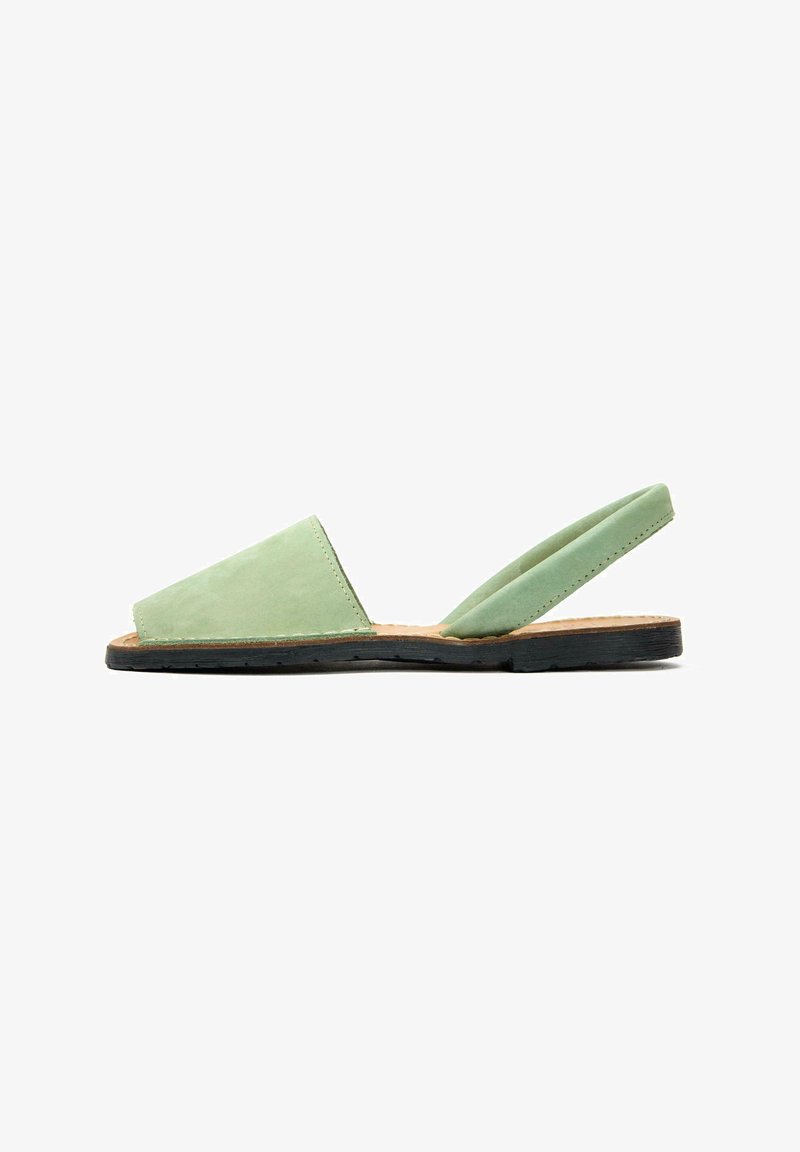 Green suede slingback sandal with a triangular toe box, soft fabric texture, and a flat black rubber sole. Simple design with minimal hardware.