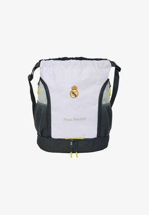Biało-szary plecak z siatkowanymi kieszeniami bocznymi, logo Real Madryt, regulowany pasek oraz zamykana na zamek kieszeń z żółtymi akcentami.