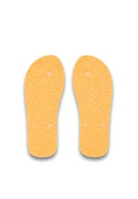 Gula gummiskoinlägg med strukturerad yta som har geometriska mönster och två cirkulära hål för fäste.