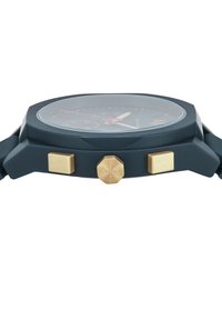 Orologio nero con cassa ottagonale, dettagli dorati, due pulsanti e cinturino in gomma testurizzata. Presenta un quadrante multicolore e un vetro protettivo.
